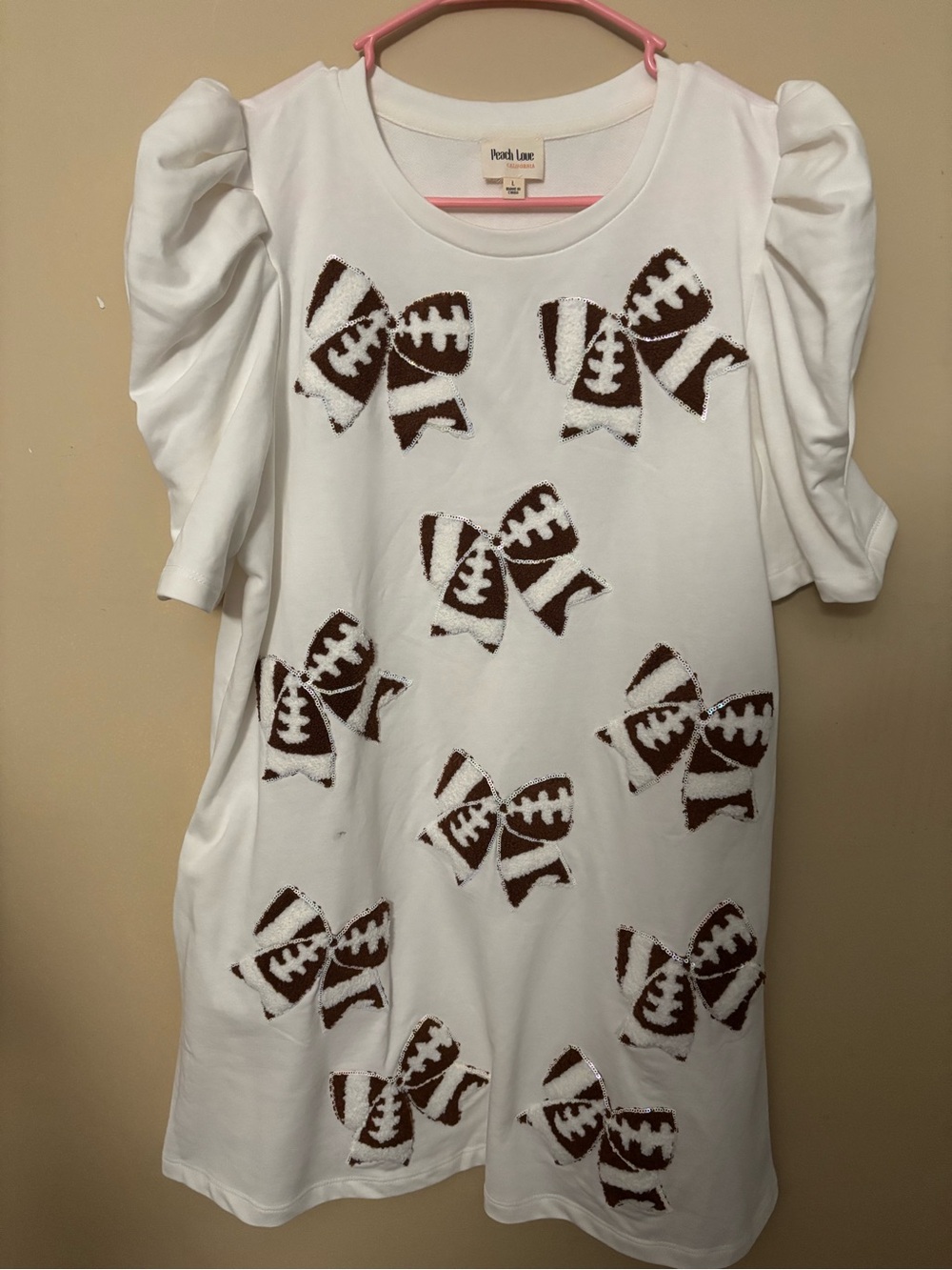 Peach Love California Football Bow Dress Large
White Brown Puff Sleeve NWOT